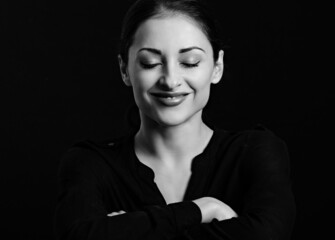 Beautiful makeup woman laughing with closed eyes on black background. Closeup portrait