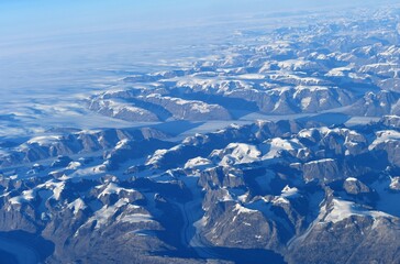 Flying over Greenland mountains and coast 