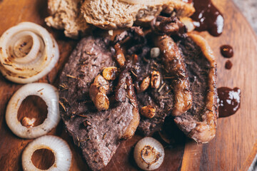 bbq beef steak with onion and pepper, grilled meat with salt and rosemary, beefsteak