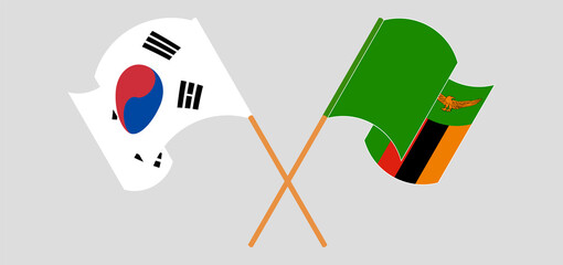 Crossed and waving flags of South Korea and Republic of Zambia