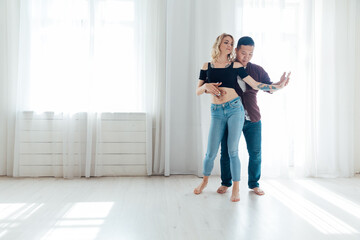 woman and man dancing to bachata music