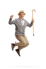 Full length portrait of a happy elderly man with a walking cane jumping