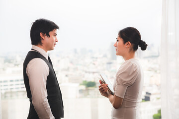 business partner with man and woman talking together in modern office, work meeting