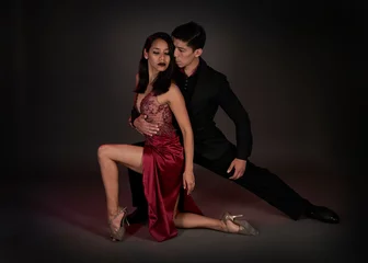 Foto op Canvas tango ballroom tango couple of latin woman and asian man, studio shot black background © gabriel