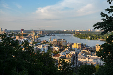 Panoramic view of Dnipro river and the historic district Podil during sunset. Kyiv, Ukraine