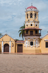 Obraz premium Mompox, Colombia - August 14, 2021: The Santa Barbara church at morning in the colonial village of Mompox.