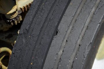 Detail of the black tyre sample at the cannon.