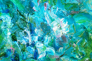 Multicolored large strokes of oil paint in blue, gteen shades on canvas, close up. Creative conception of abstract and bright background. Palette of artist.