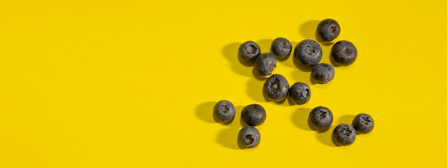 various blueberries on yellow background