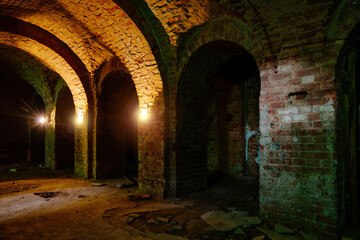 Naklejka premium Vaulted red brick dungeon under old castle