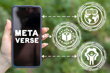 Metaverse is coming soon. Meta universe new virtual blockchain reality. Hand hold a smartphone with inscription a meta verse. VR environment technology.