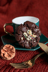 Chocolate Christmas Cookies with walnuts and chocolate chips on the table. Horizontal, biscuits festive background.