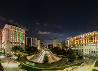 Obraz premium Sao Paulo, Brazil December 12 2021. Panoramic view of Anhangabau Valley, city hall building, Light Shopping mall, and entrance of Anhangabau Tunnel and 23 de Maio Avenue in downtown Sao Paulo