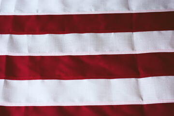 A view of the red and white stripes of the United States of America flag.