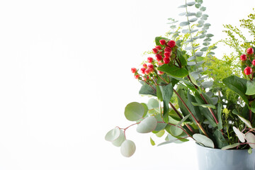 A view of a beautiful Christmas style flower bouquet, featuring hypericum berries and eucalyptus...