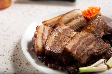 A view of a plate of braised pork belly.