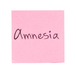 Pink sticky note with word Amnesia on white background