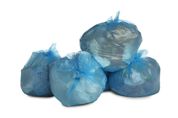 Blue trash bags filled with garbage on white background