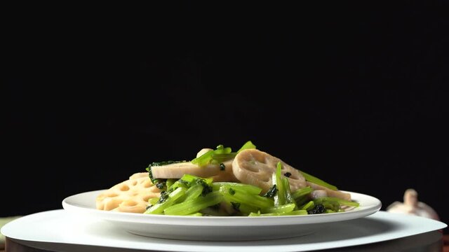 Chinese style home-cooked stir-fried celery and lotus root slices