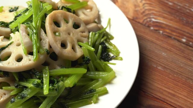 Chinese style home-cooked stir-fried celery and lotus root slices