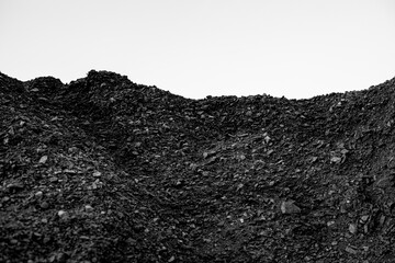 A pile of coal on a white background.