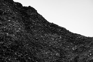 A pile of coal on a white background.