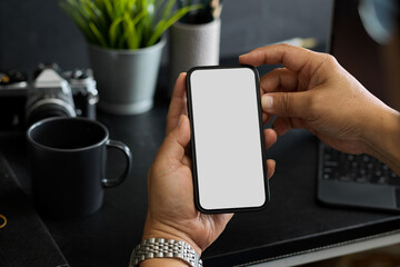 Smartphone blank screen mockup on a man hands