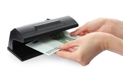 Woman checking Euro banknote with currency detector on white background, closeup. Money examination device