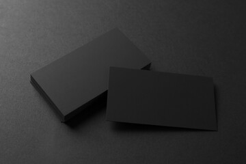 Fototapeta Blank business cards on black background, above view. Mockup for design obraz