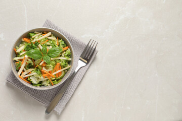 Delicious turnip salad served on light grey table, flat lay. Space for text