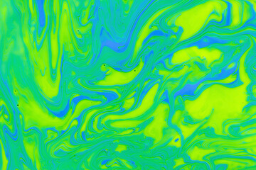Attractive bright marble gradient, abstract background mixed yellow, green and blue nail polish,...