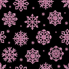 Vector seamless pattern glitter pink snowflakes isolated on black background.
