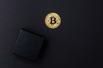 a bitcoin bitcoin on a dark background. minimalistic composition. Concept gift . Copy space