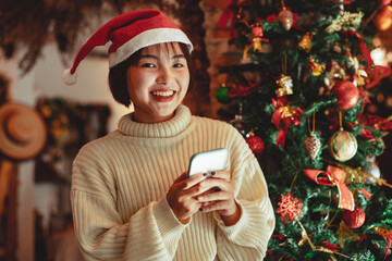 girl use smartphone and enjoy christmas holiday,  new year celebration concept