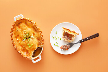 Tasty beef pot pie on color background