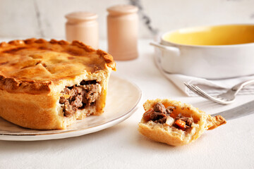Tasty beef pot pie on table