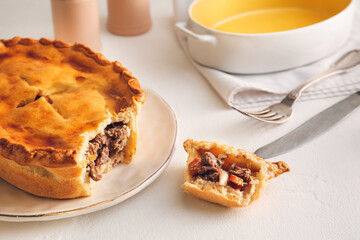 Tasty beef pot pie on table