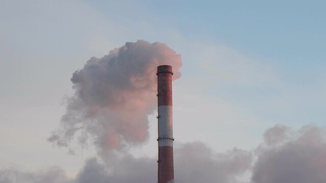 Factory pipe polluting air, smoke from chimneys. environmental problems, ecological theme, industry scene.