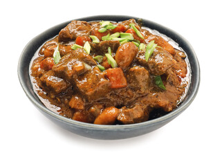 Plate with tasty beef curry on white background