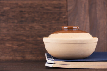 Casserole on top of ancient books