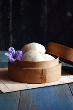 steamed bun named bao zi or bapao in a patterned plate 