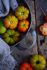 fresh tomatoes in a rustic tray
