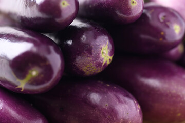 Close up of fresh organic purple eggplant texture background