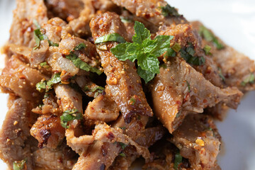 Spicy Grilled Pork Neck Larb, a popular Thai dish