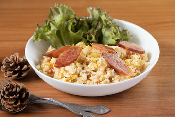 Fried rice with chinese sausage(Kun Chiang fried rice) in a white plate