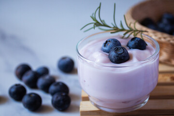 Fresh blueberry yogurt in a clear glass