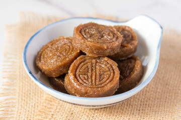 Rice dessert with brown sugar stirred in a mold (khao tu dessert) in a cup, Thai dessert