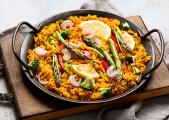 Vegan Paella on gray background.