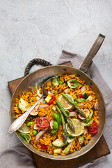 Vegan Paella on gray background.