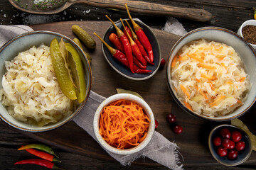 Pickled vegetables on wooden background. Salting vegetables.